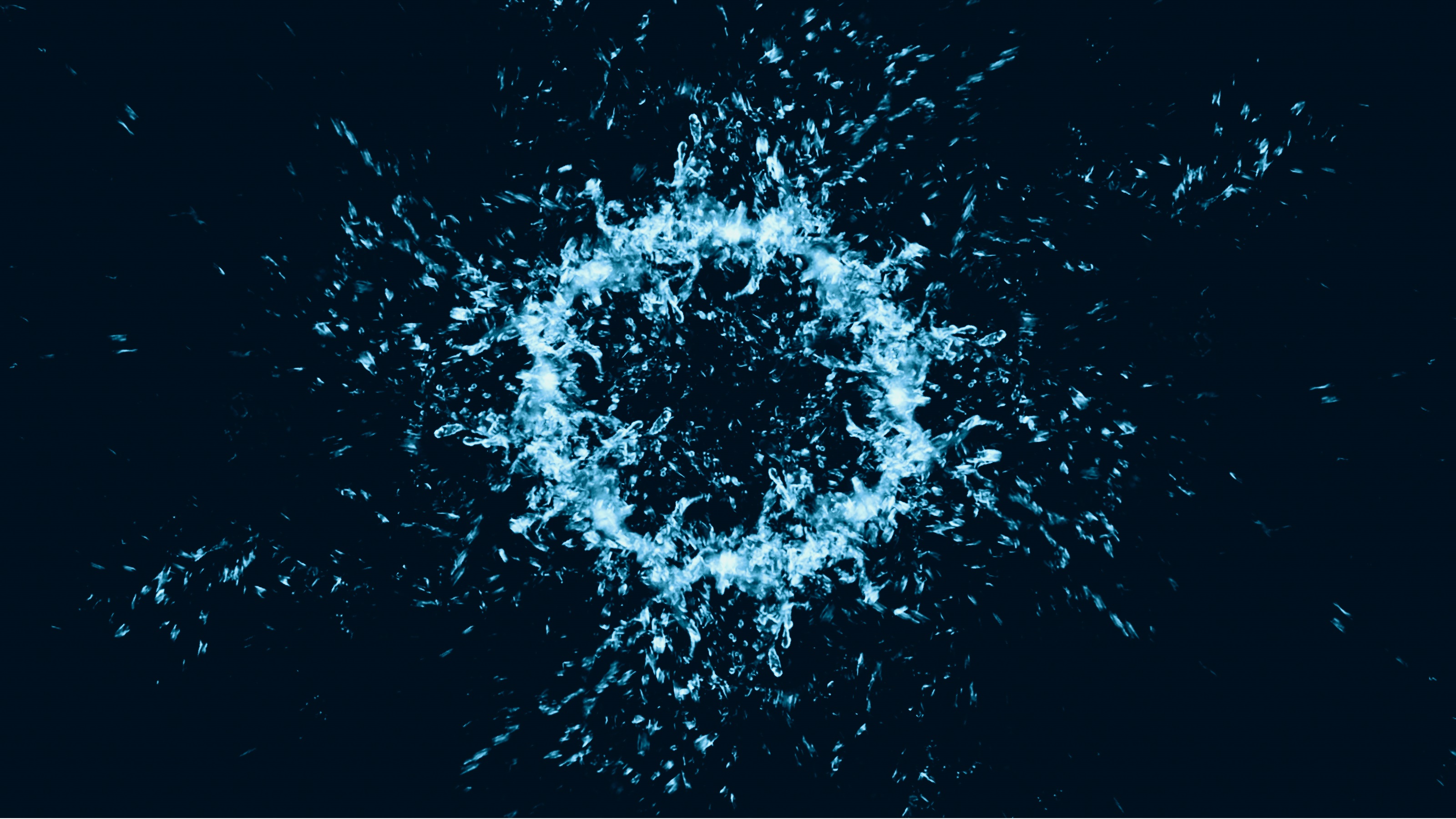 A blue bubble bursts against a black backdrop.