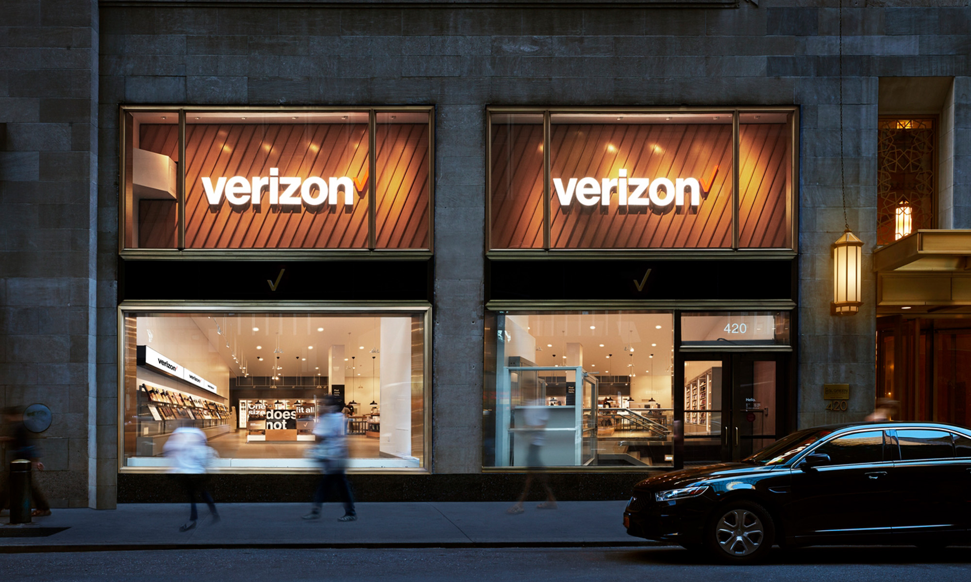 A storefront with two large Verizon logos in the windows.