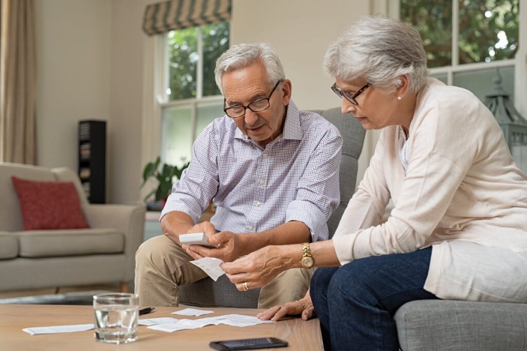 Two people looking at financial paperwork.