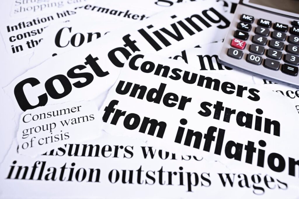 Newspaper headline clippings related to inflation.