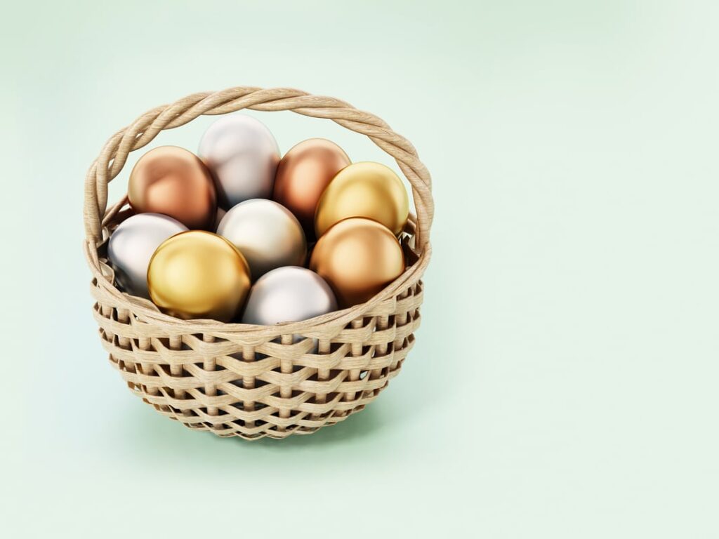 A basket with metallic eggs in it.