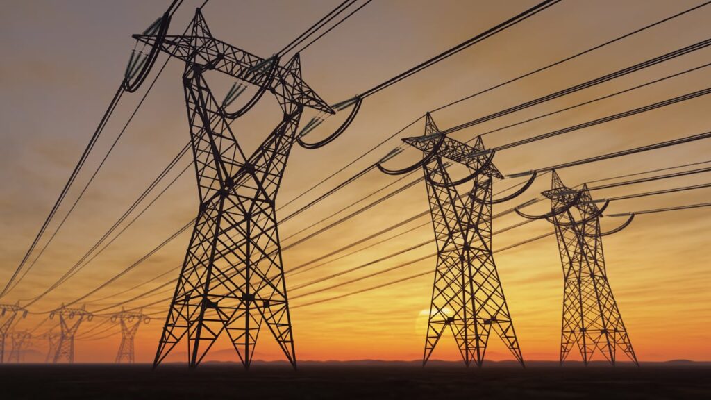 Power lines in the sky at sunset.