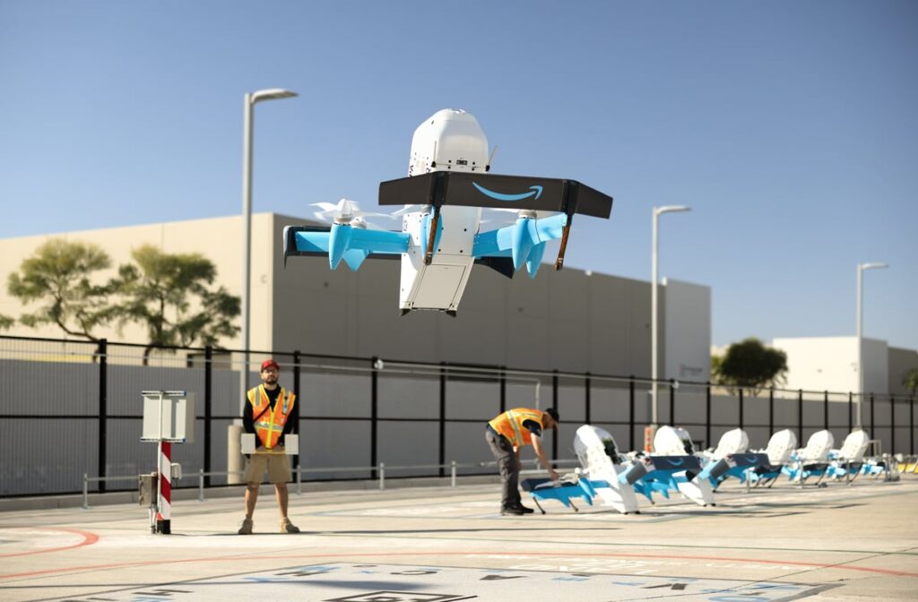Workers launching Amazon Prime delivery drones.