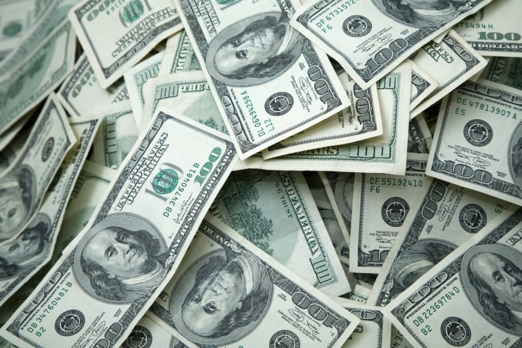 A loose collection of $100 bills.