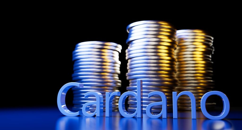 The word "Cardano" stands in front of a pile of coins.