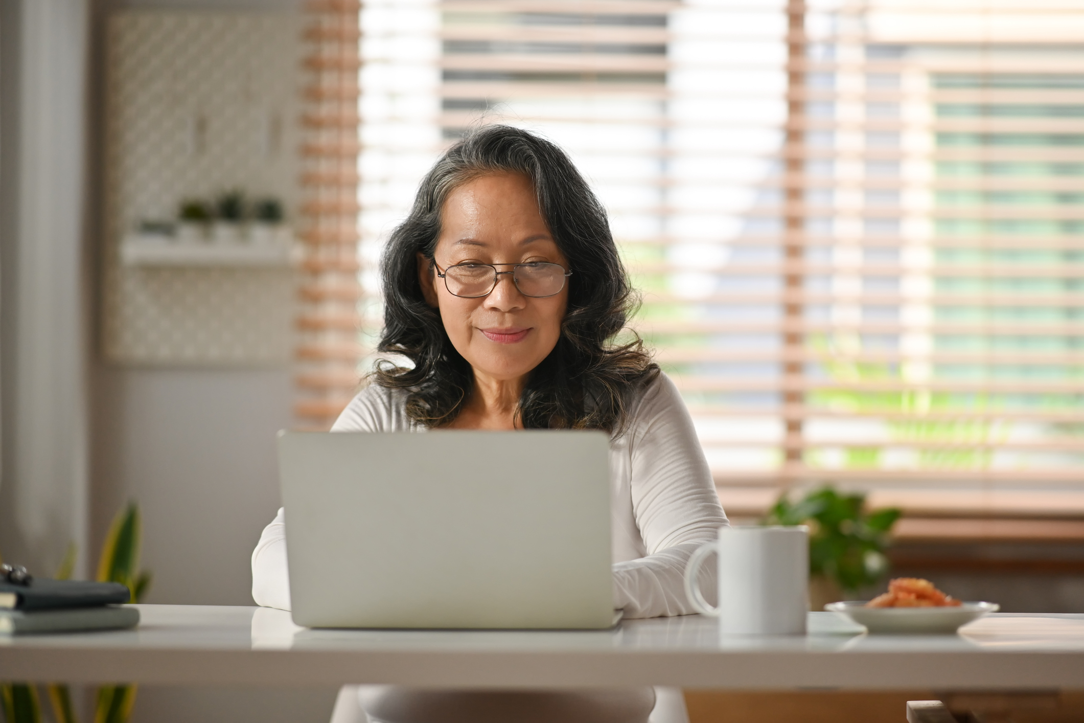 A woman sitting at a desk in a home office