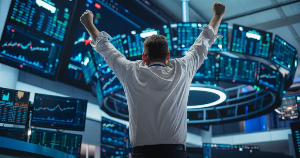 Person raising both fists in the air.