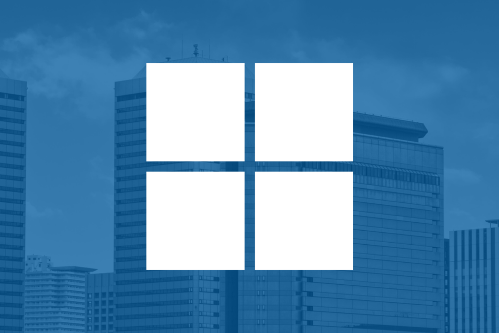 Microsoft's logo overlaid on a shadowy blue background.