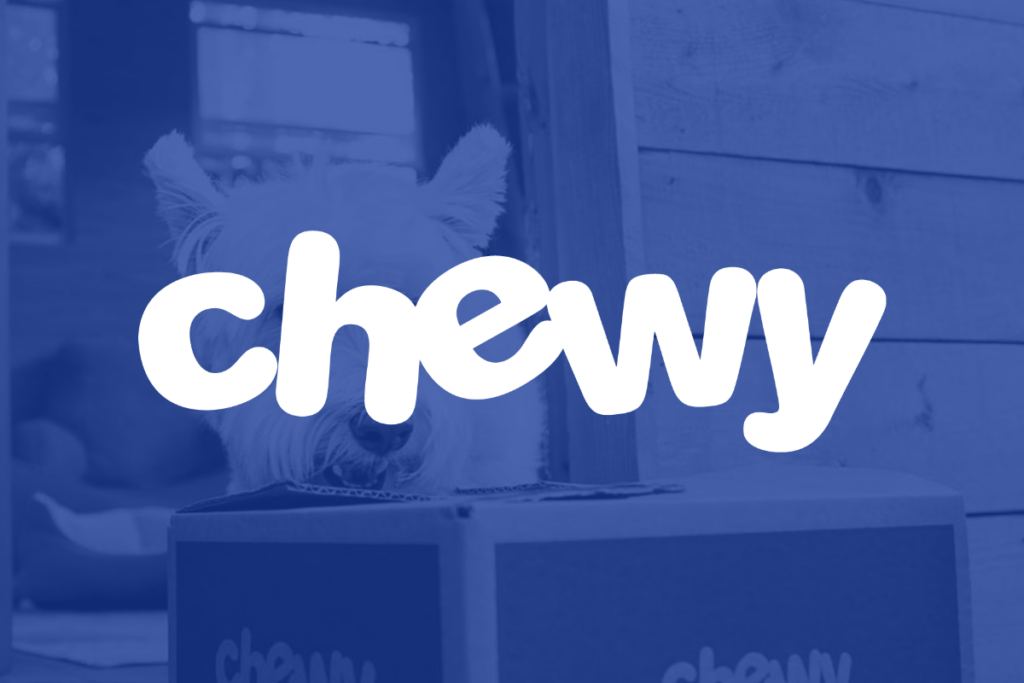 A white "chewy" logo sits against a blue backdrop of a Chewy package being sniffed by a dog.