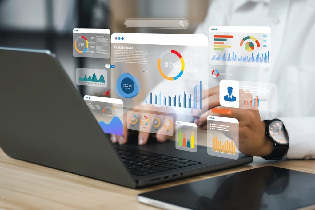A person looking at metrics on a laptop.