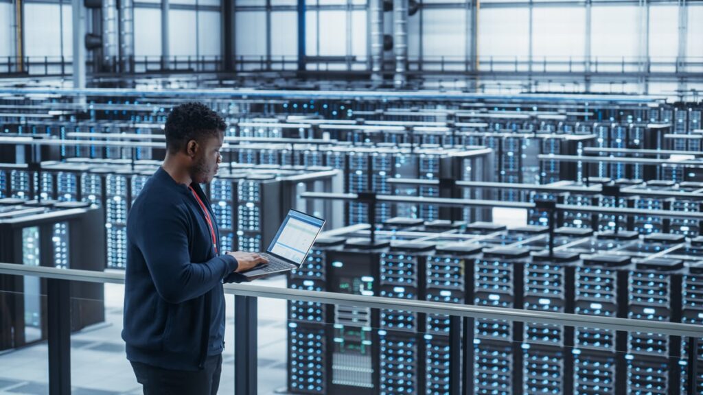 An engineer overlooking a data center.