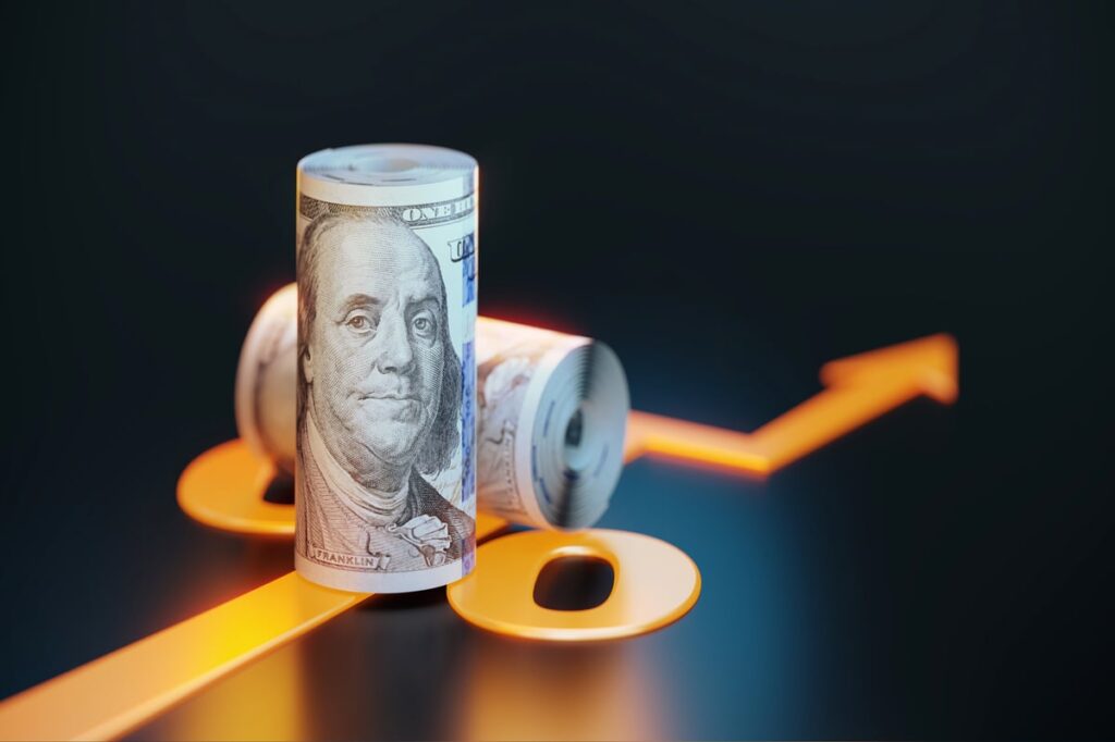 A roll of hundred-dollar bills and a chart line.