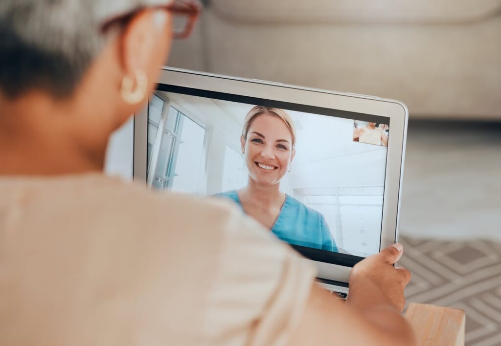 Two people participating in a telehealth session.
