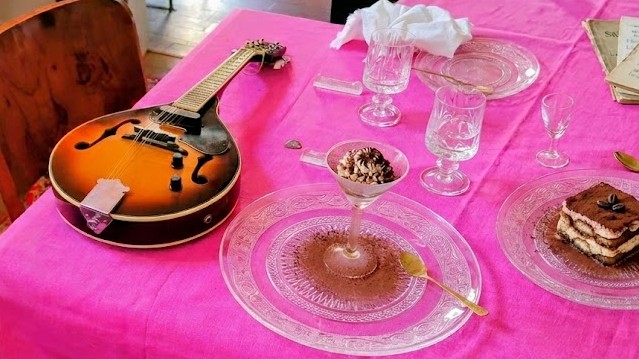 A mandolin and tiramisu desserts rest on the dining table of an Airbnb Experiences host in Rome, Italy.