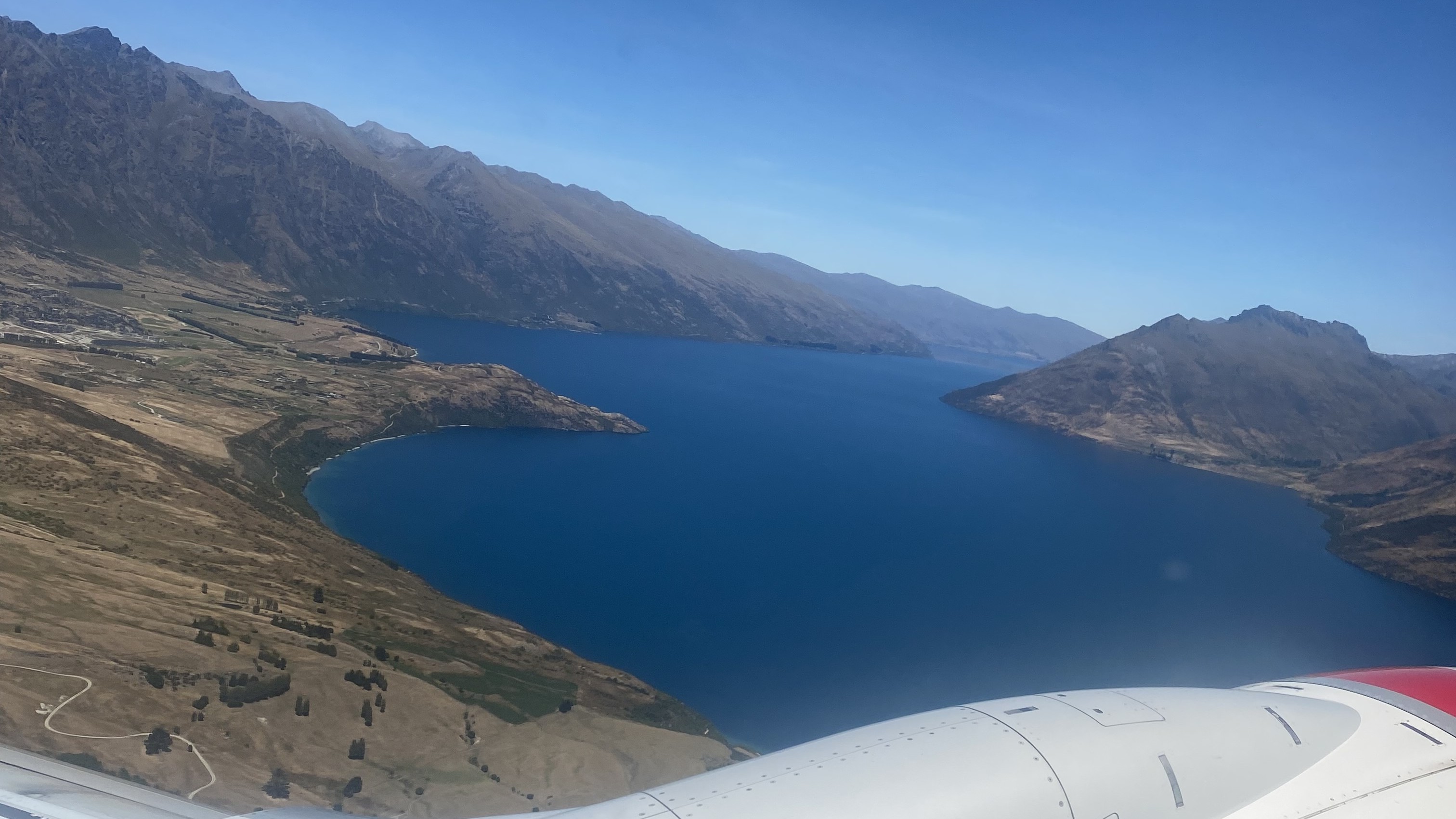 Looking out an airplane window over Queenstown, New Zealand.
