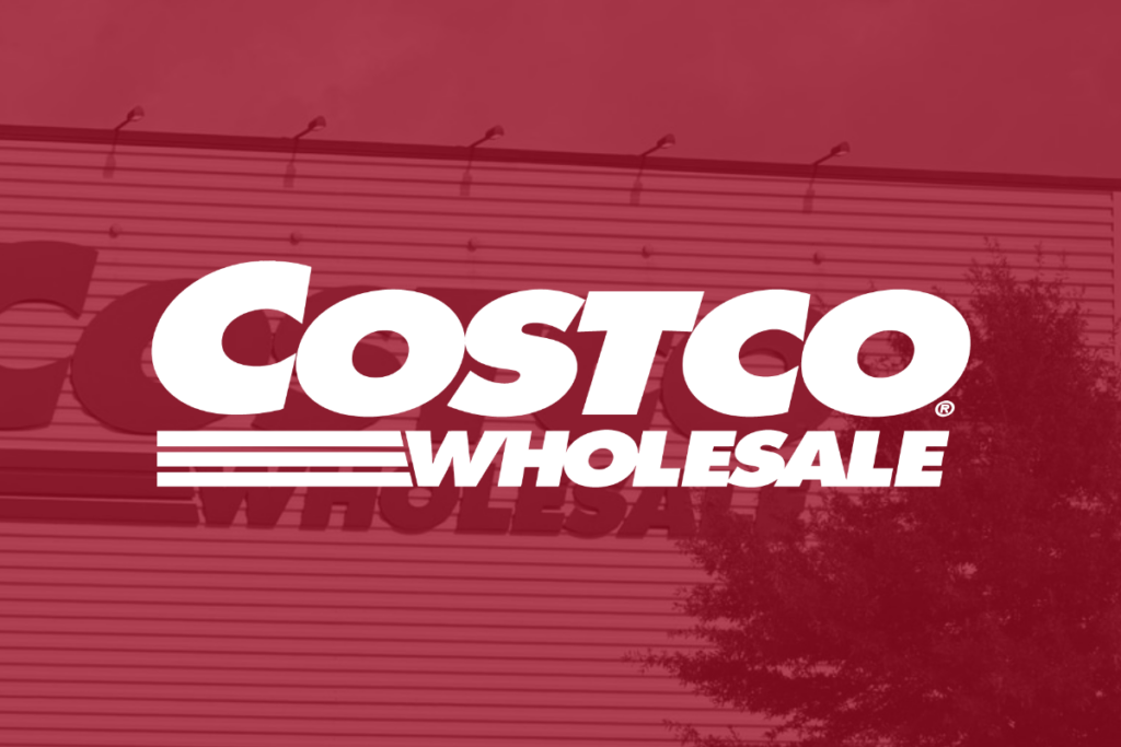 The Costco logo in front of a Costco store.