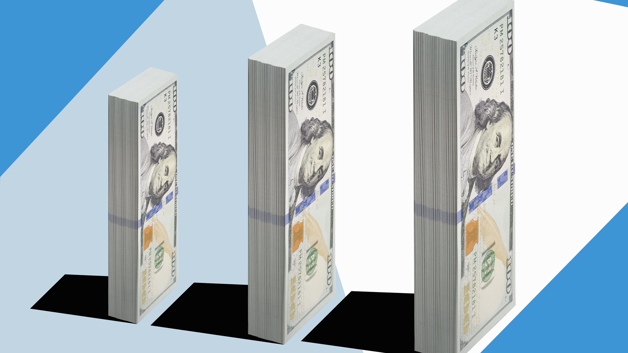 Vertical stacks of hundred-dollar bills grow taller.