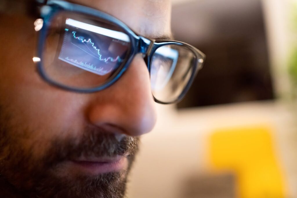 Serious person looking at a computer screen.