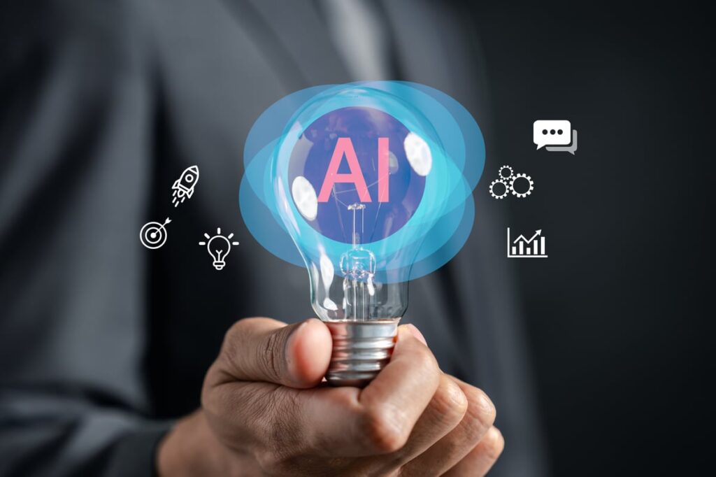 Person holding a light bulb with the word AI in it.