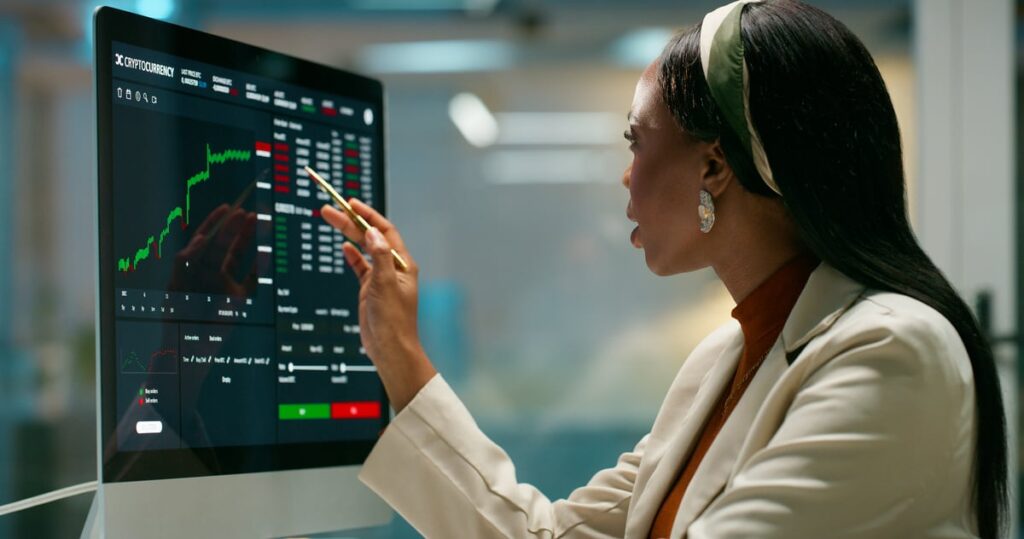 A stock trader checks a trading screen.