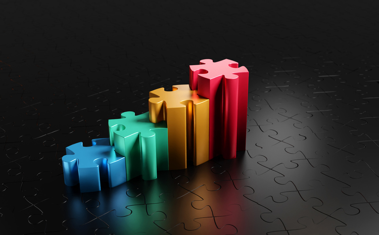 multi-colored, 3-D jigsaw puzzle pieces that are different heights, connected to form steps