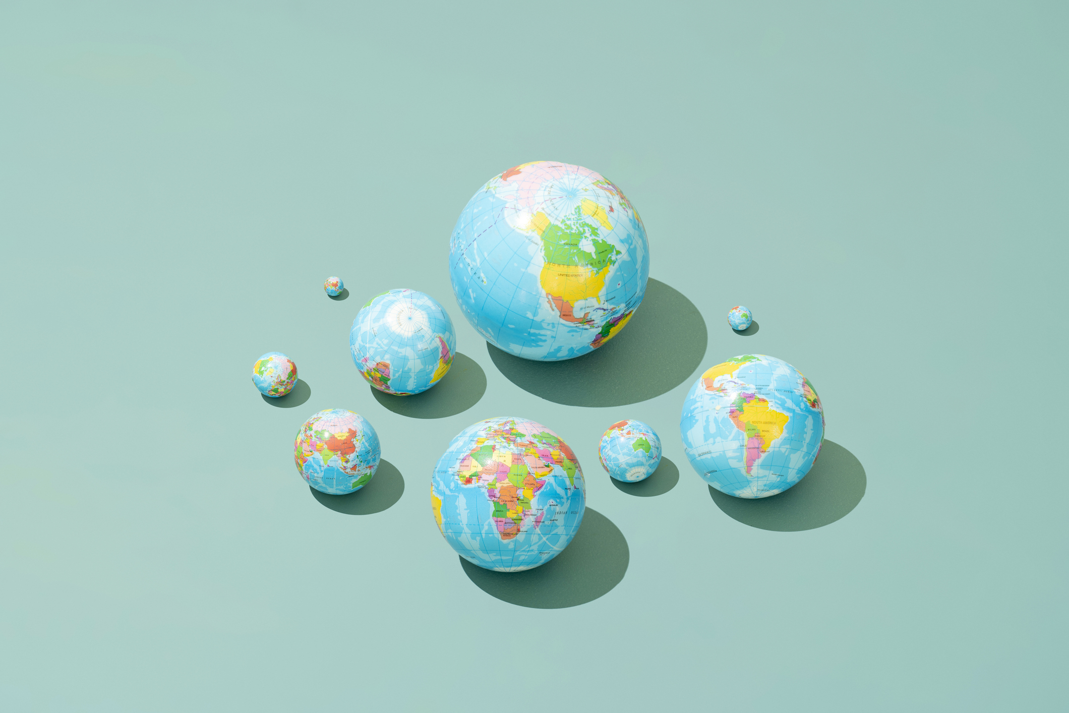 Planet Earth in different sizes and different continents.