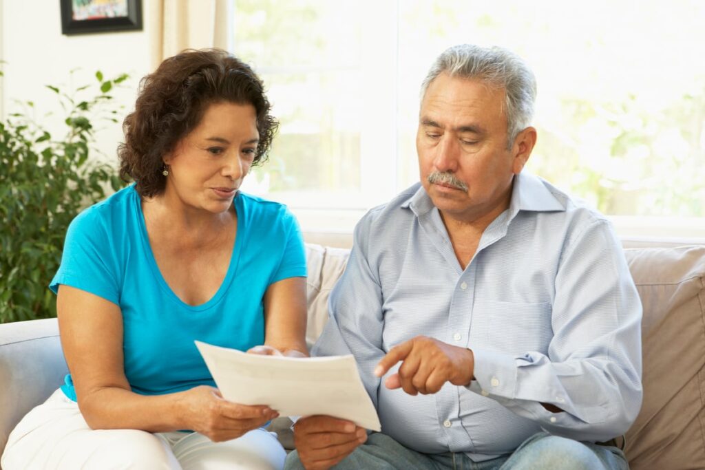 Two people discussing a document together.
