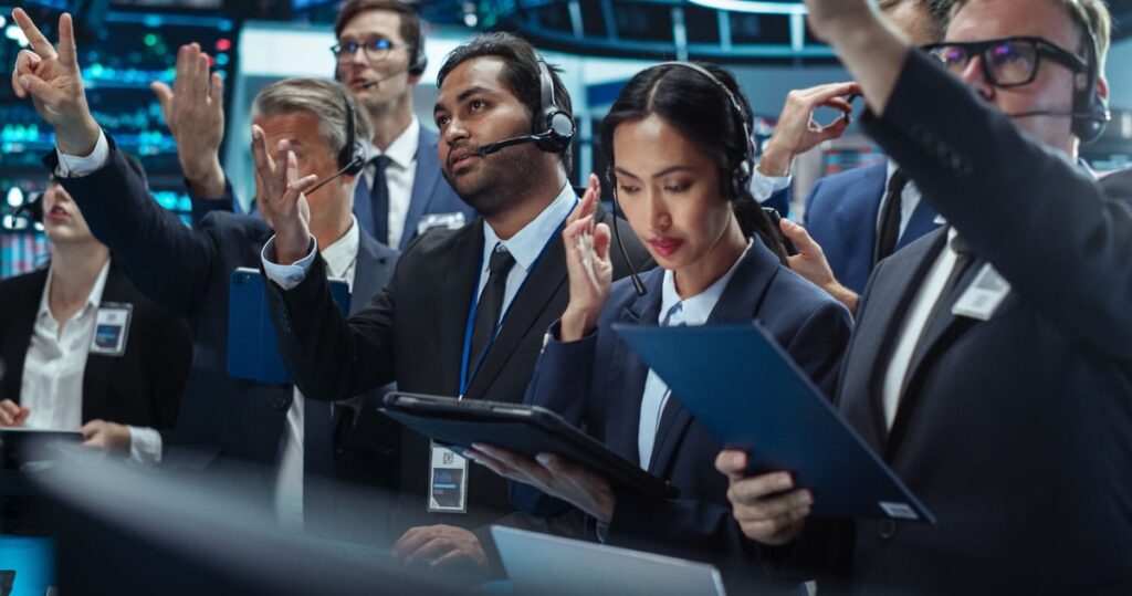Traders working on the floor of a stock exchange.