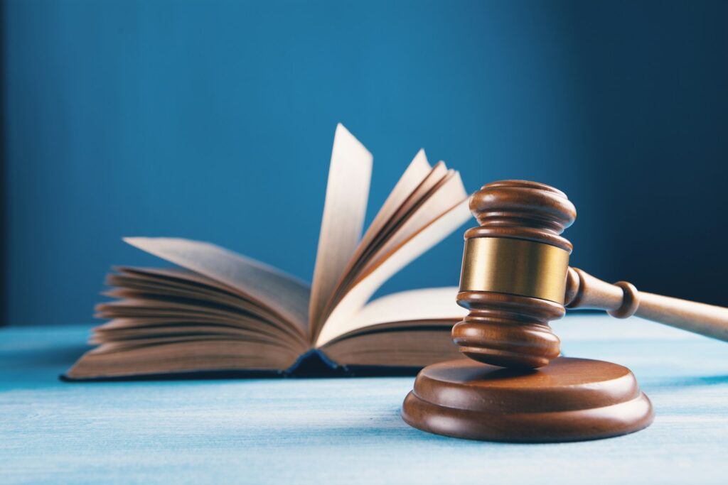 judges gavel and open book on table; legal issue