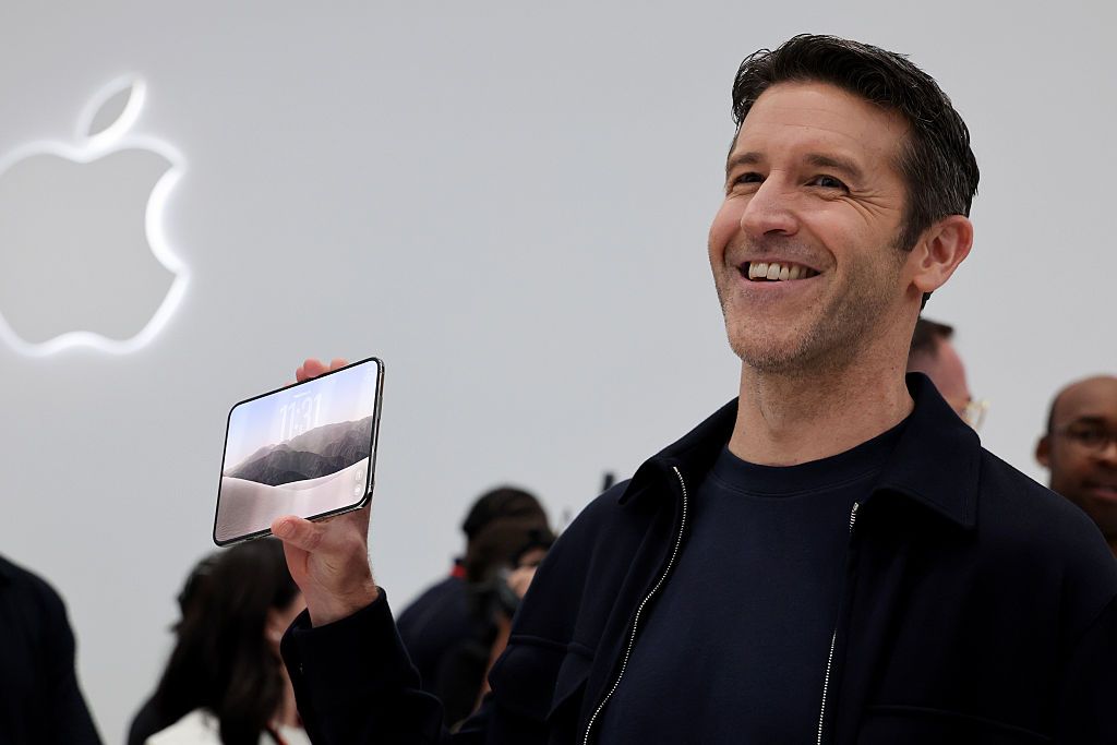 Apple CEO John Ternus holds the iPhone Duo during Apple&rsquo;s &ldquo;Surprise and Shine&rdquo; event at the company's corporate headquarters