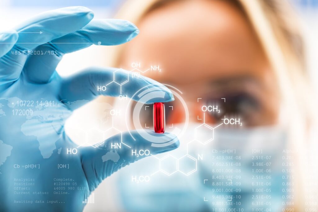 A researcher studies a capsule.