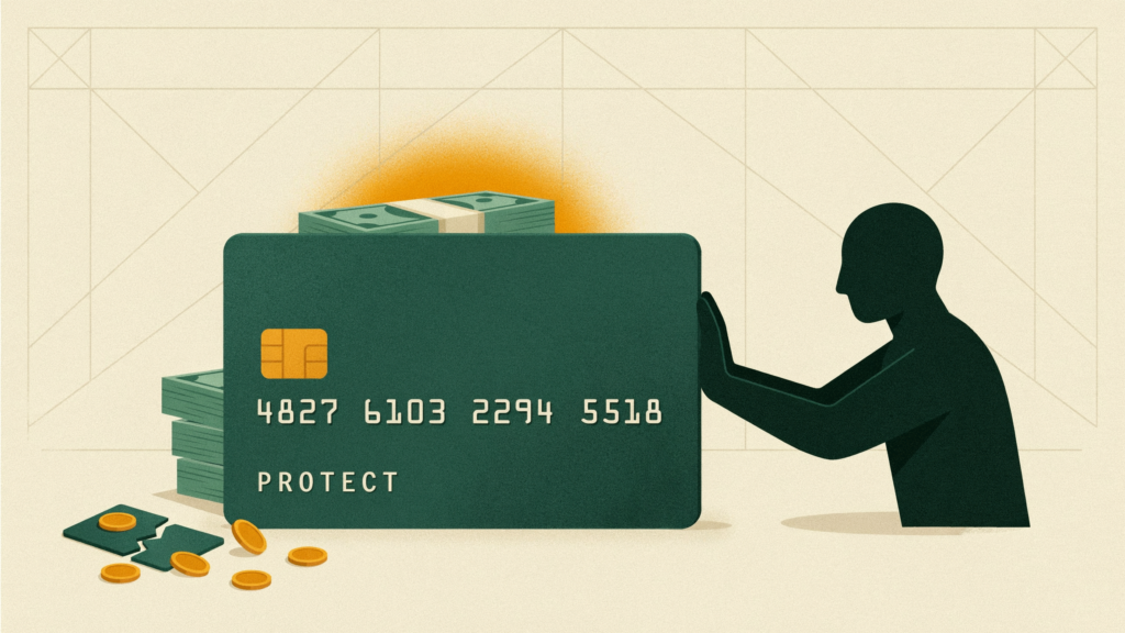 A giant credit card stands as a wall, blocking a masked thief from a glowing stack of savings behind it.