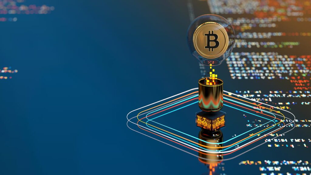 A Bitcoin symbol floats above a screen displaying computer code.