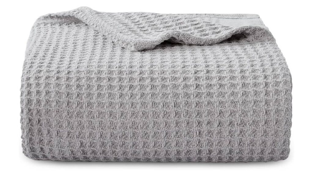 Amazon's all-season 100% cotton throw blanket with over 17,500 5-star ratings is only $42