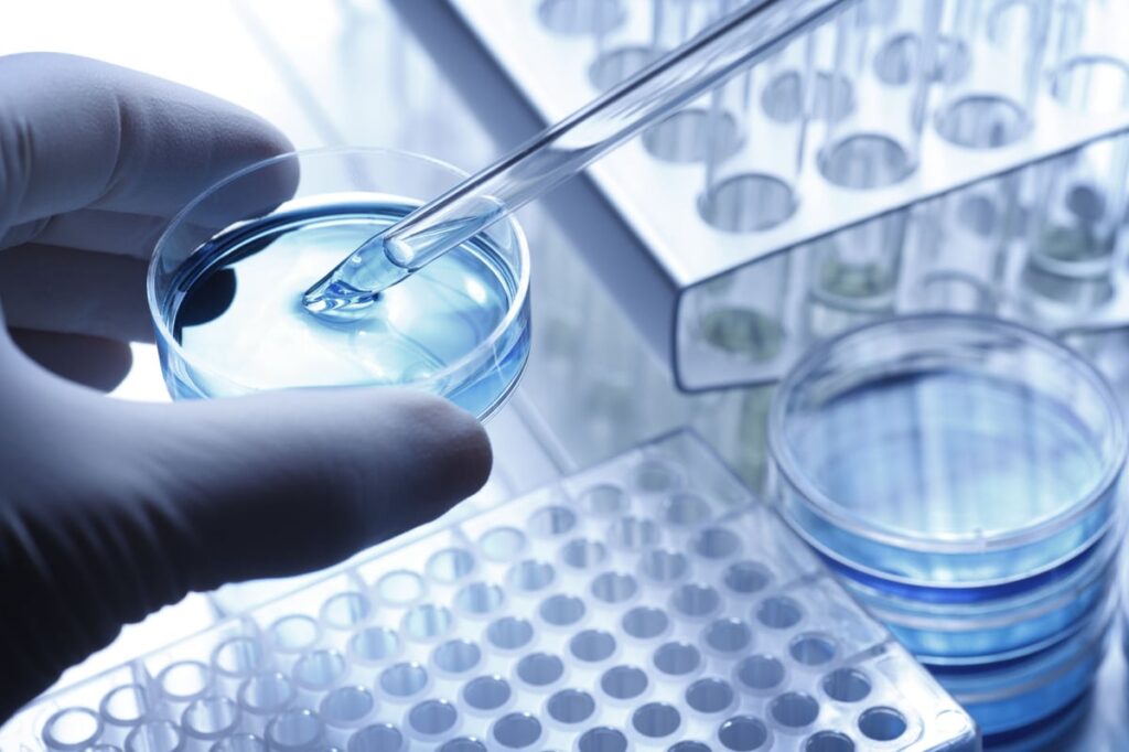 A pharmaceutical lab technician is preparing a test sample.