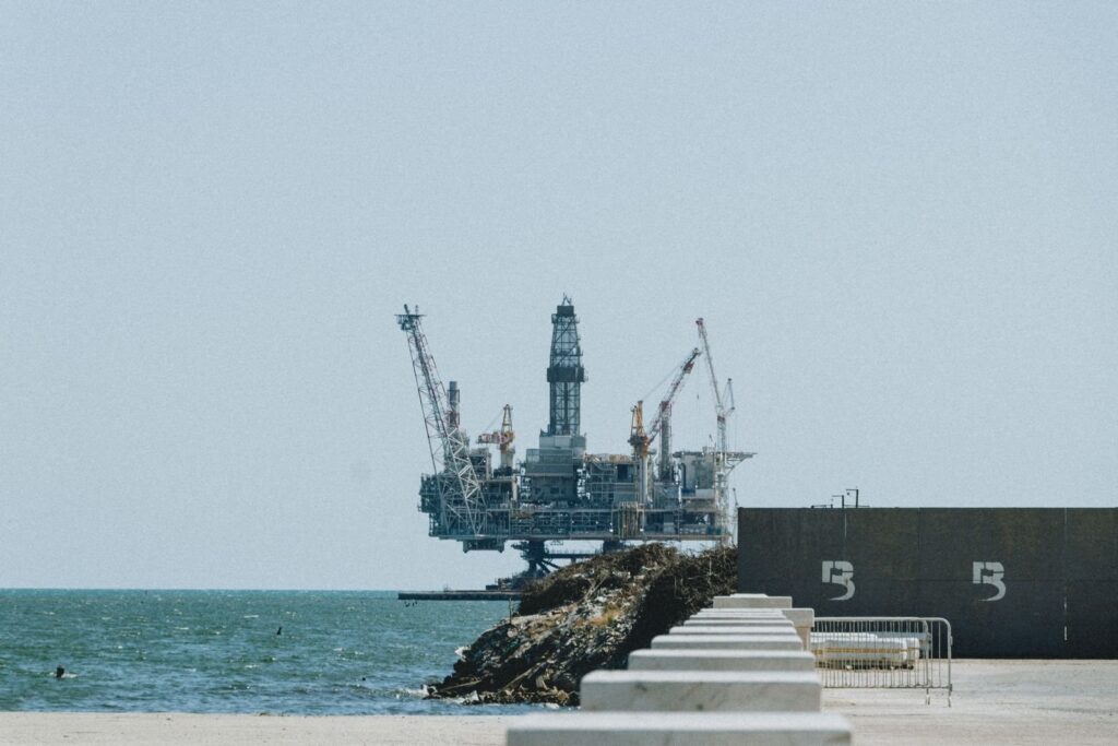 An offshore oil and gas platform with cranes at sea