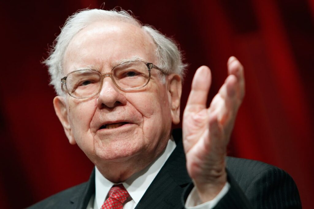 Warren Buffett using hand gesture while speaking.
